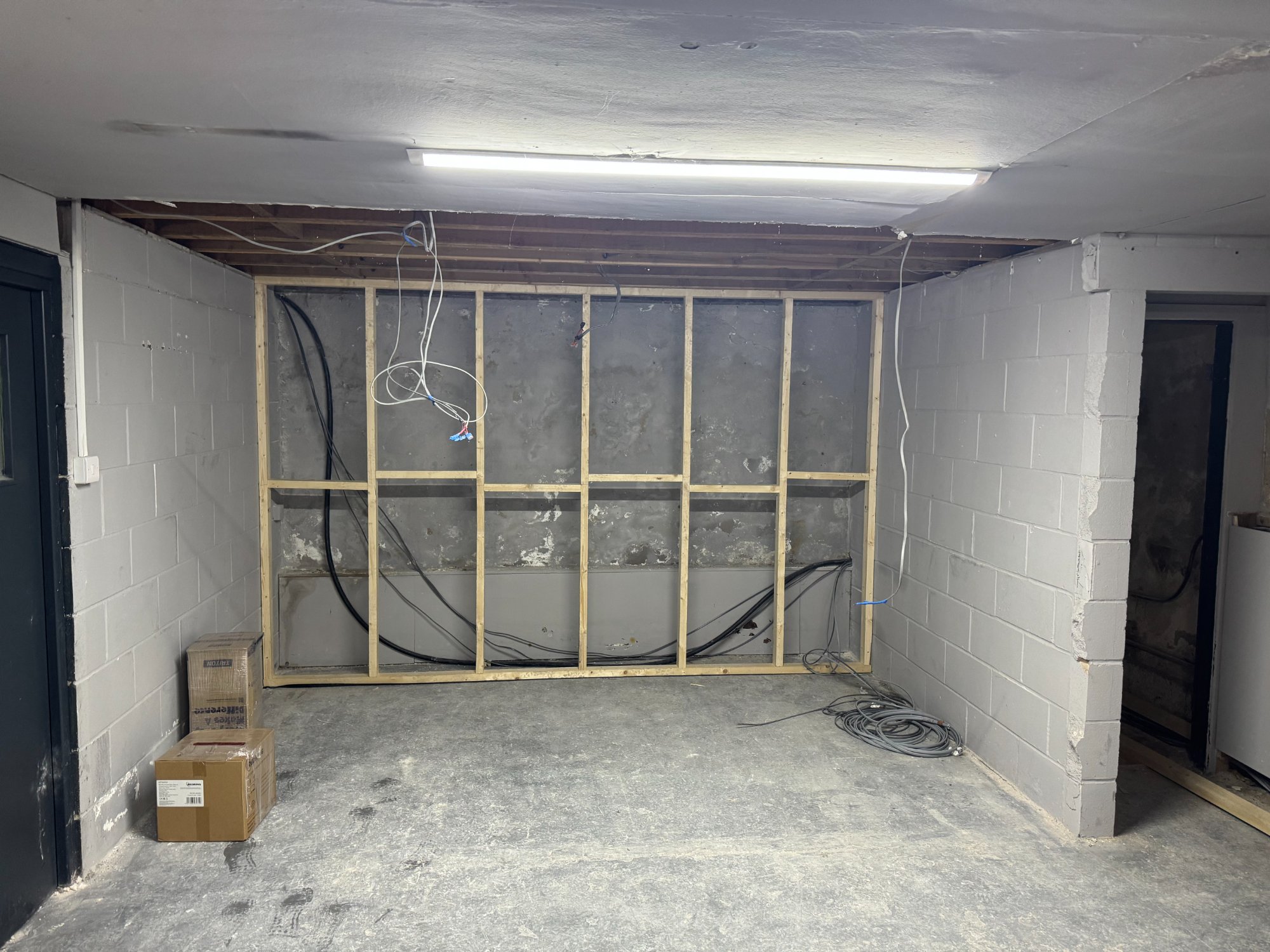 Room with stud wall framing and cables