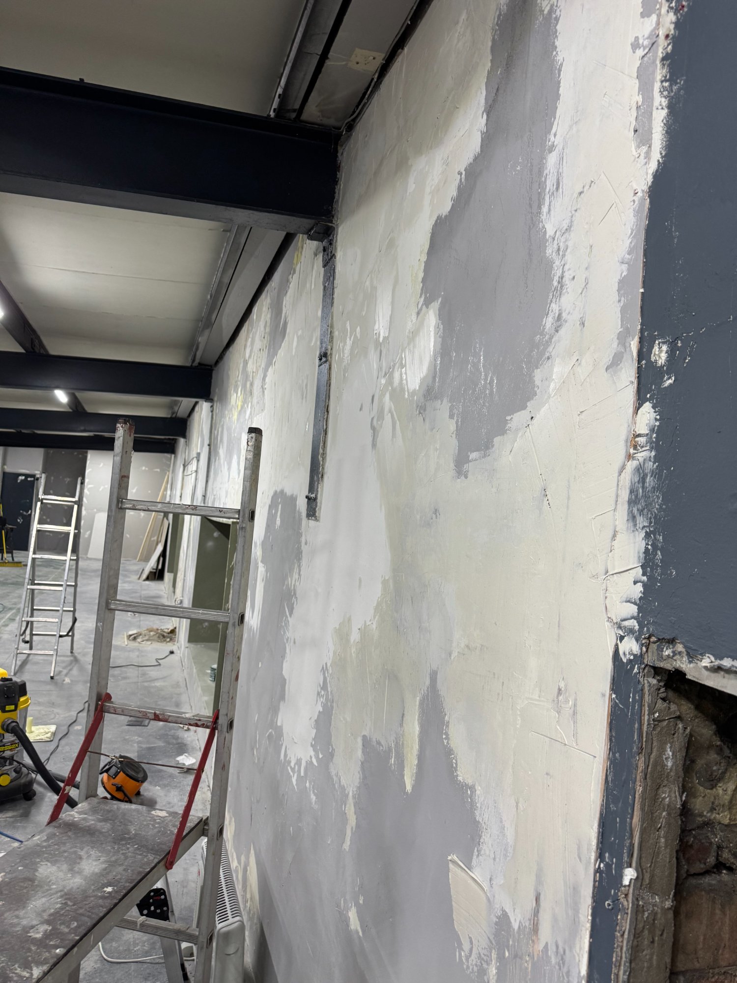 Wall being carefully prepared and painted