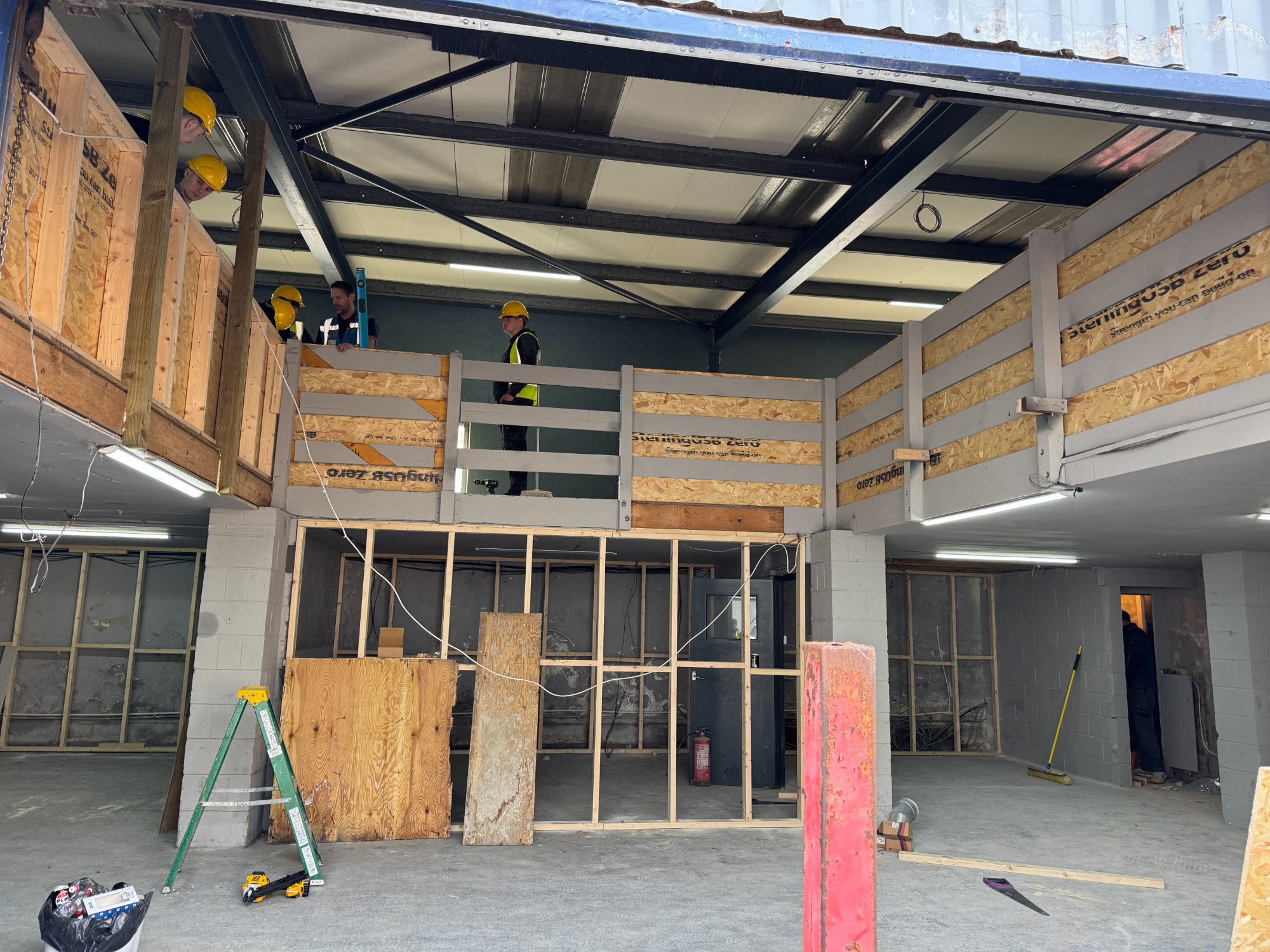 Students on the mezzanine with OSB boarding