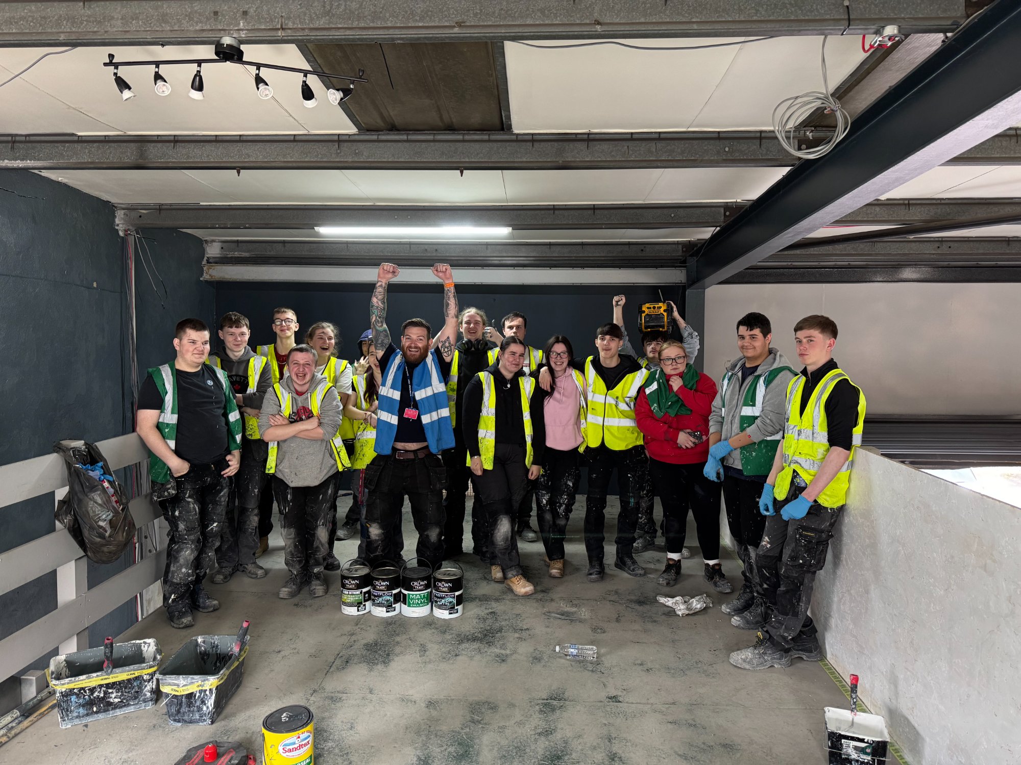 Group celebrating with hands raised