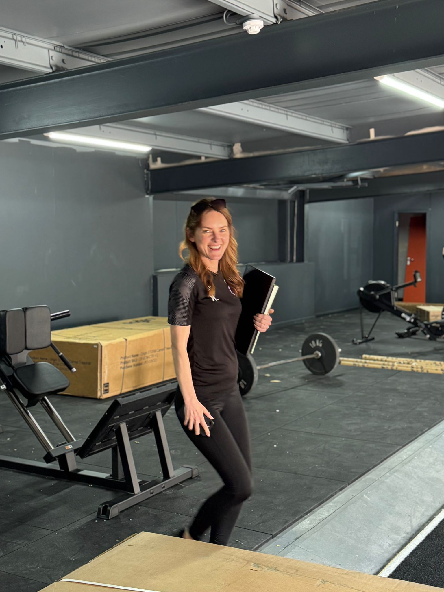 Mikaela in Legacy branded kit on the gym floor